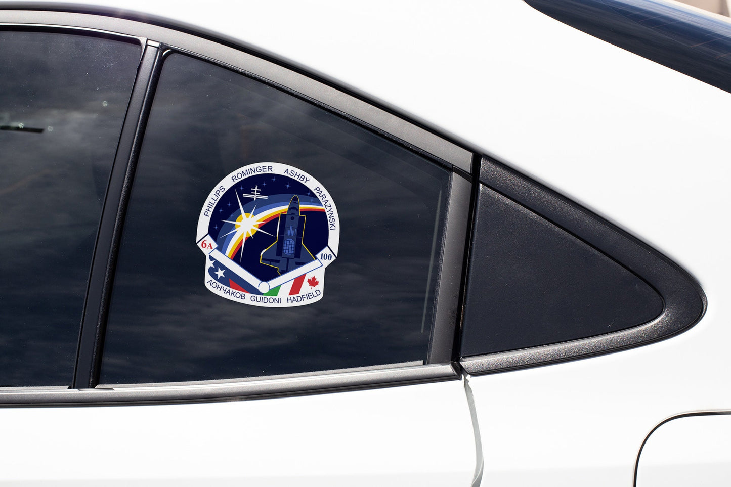 a close up of a car window with a sticker on it
