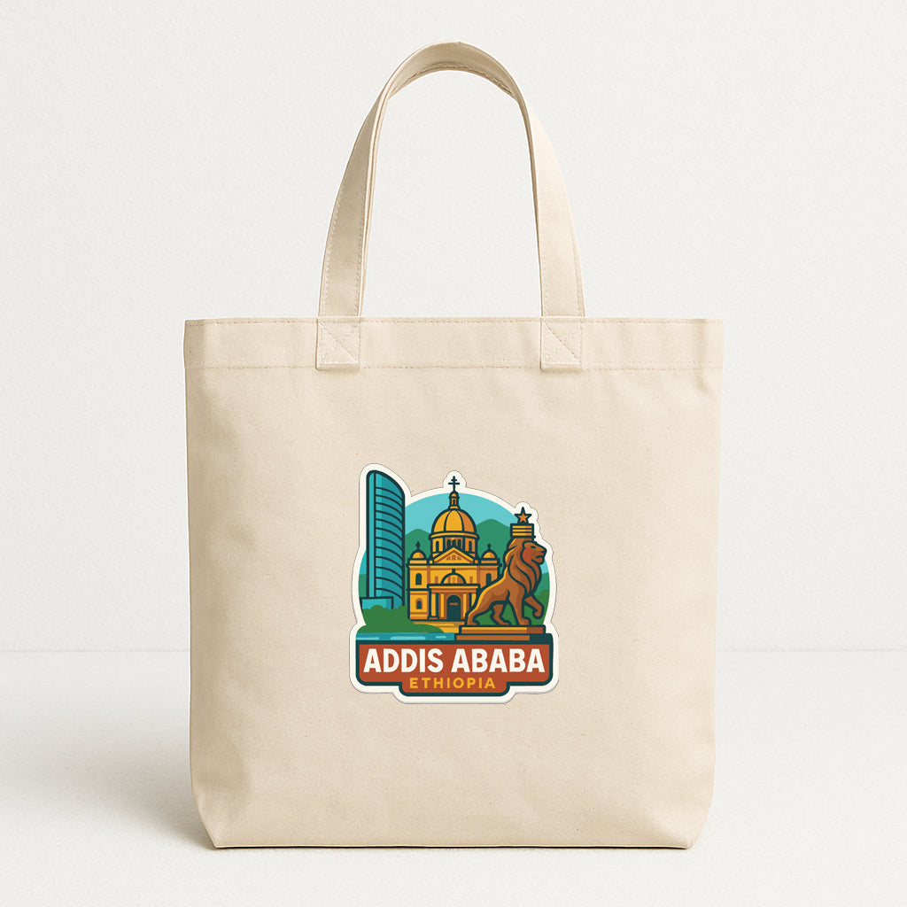 a beige tote bag with a graphic design depicting a city skyline, including a tall building and a church, along with the text "ADDIS ABBA" and "ETHIOPIA".