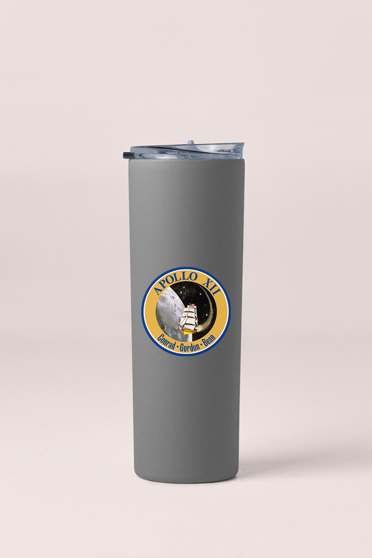 a stainless steel tumbler with a nasa emblem on it
