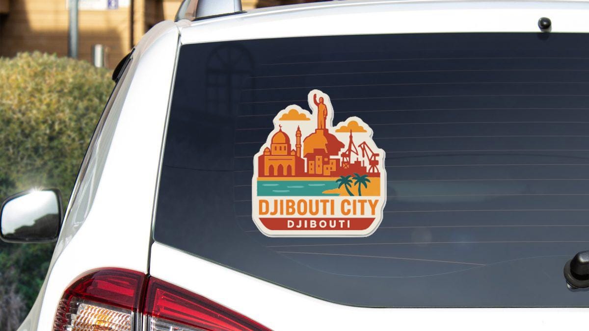 A sticker on the rear window of a white car, depicting a cityscape with a statue and palm trees.