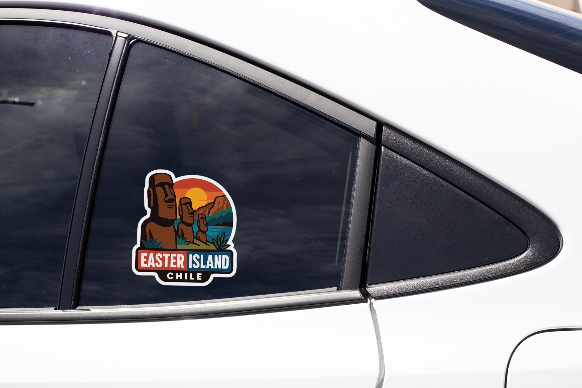A sticker on the side of a car window, depicting Easter Island and the text "Easter Island Chile".