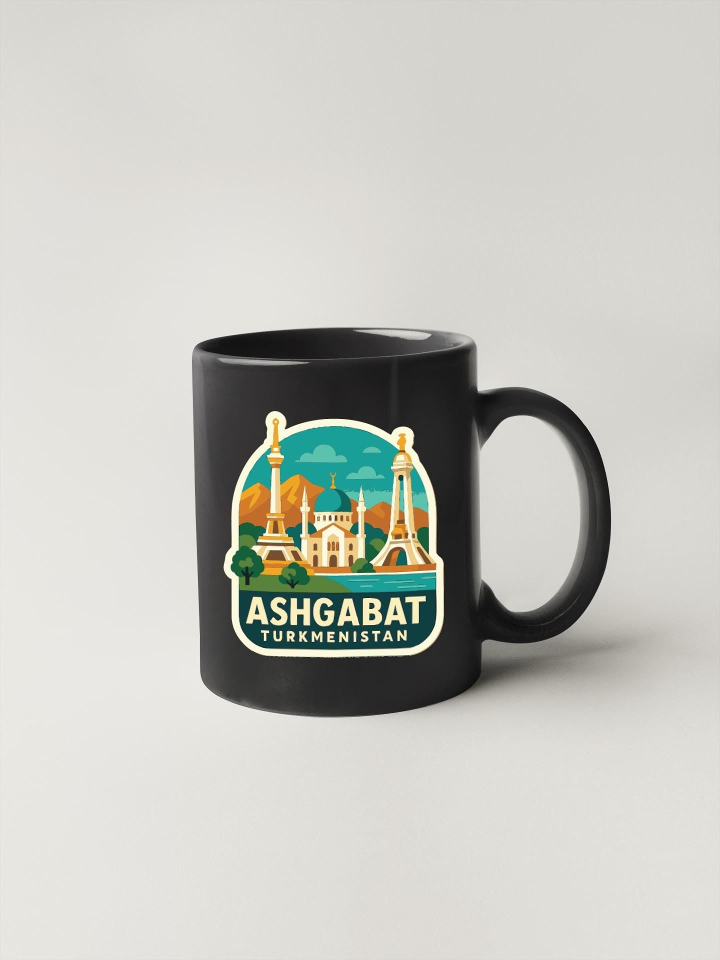 A black coffee mug with a graphic design depicting the skyline of Ashgabat, Turkmenistan.