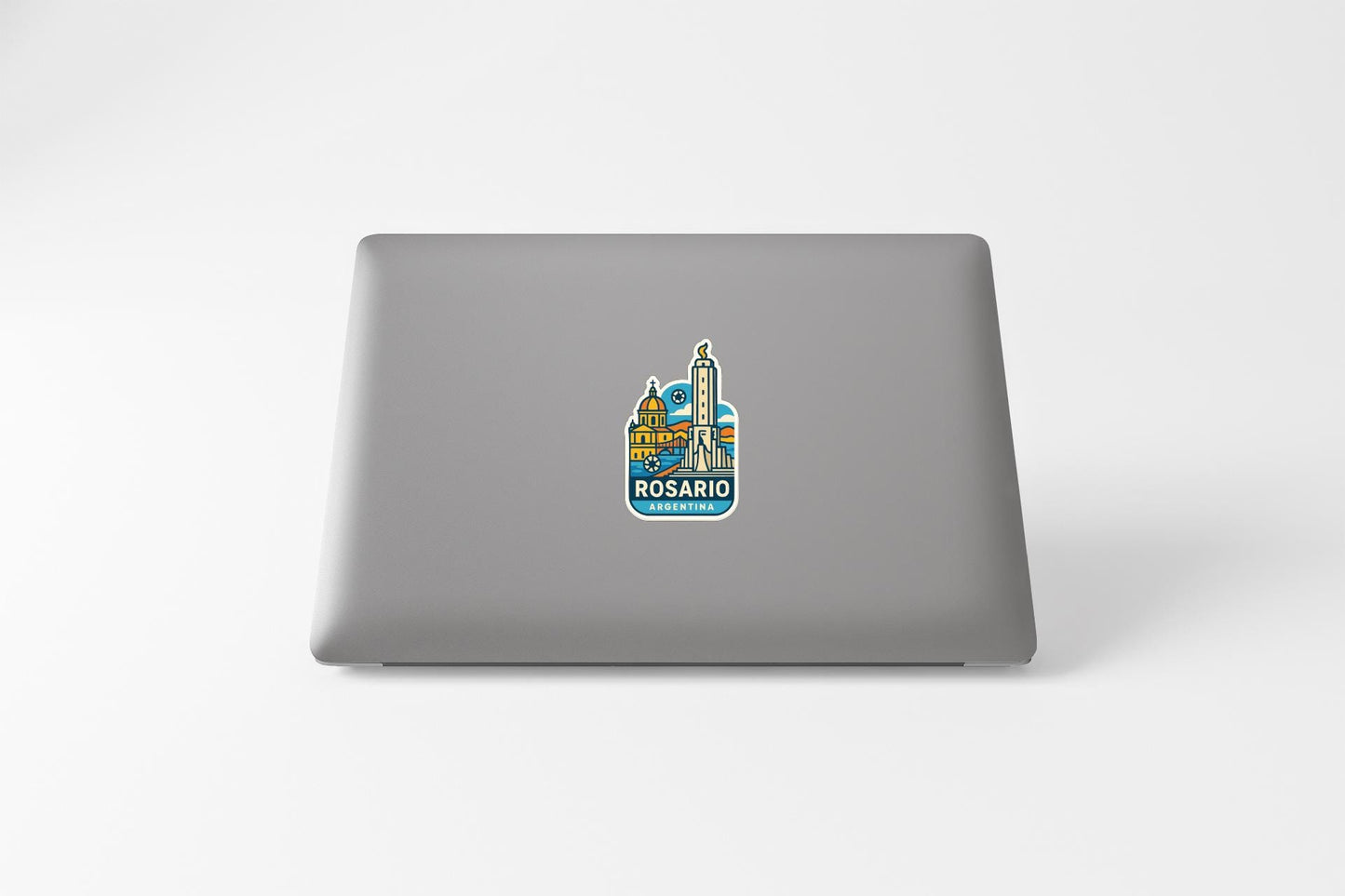 a sticker of Rosario, a city in Argentina, on the back of a laptop.