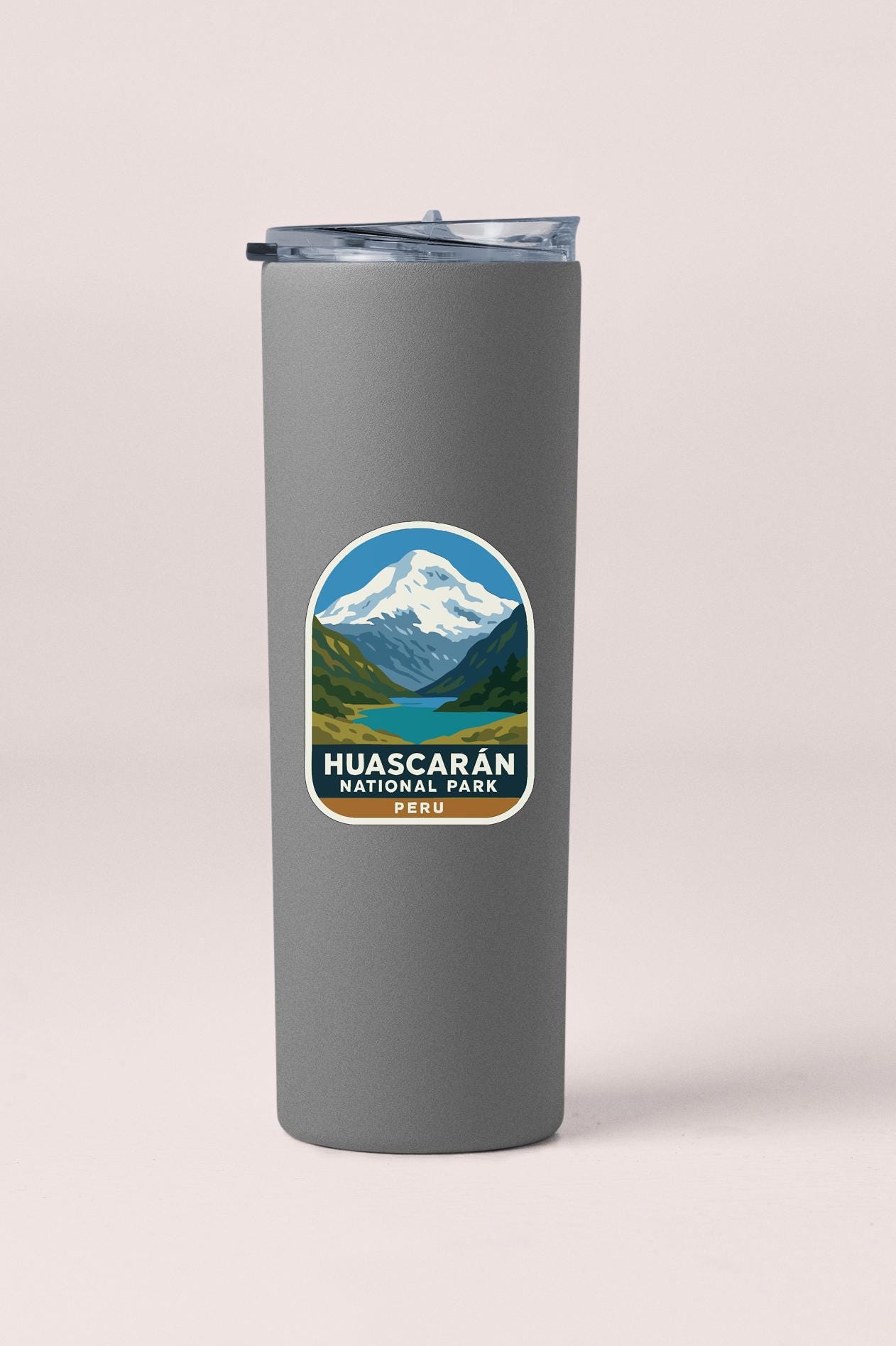 A gray insulated tumbler with a label that says "HUASCARAN NATIONAL PARK PECU".