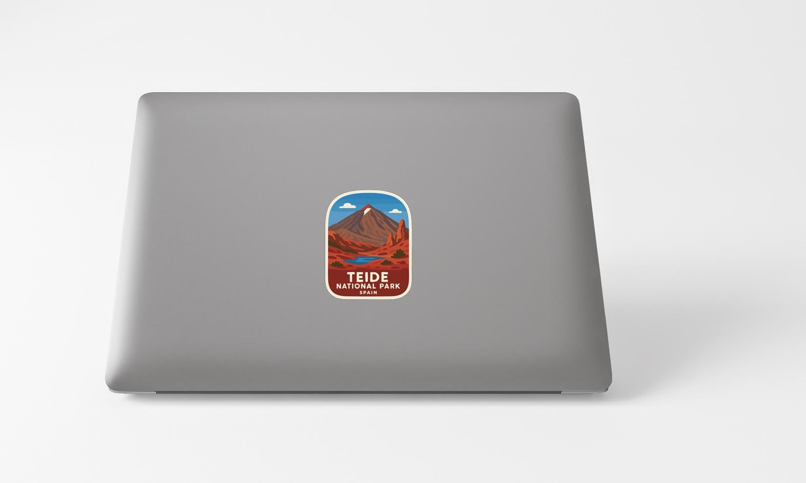 A sticker of Teide National Park on the back of a laptop computer.