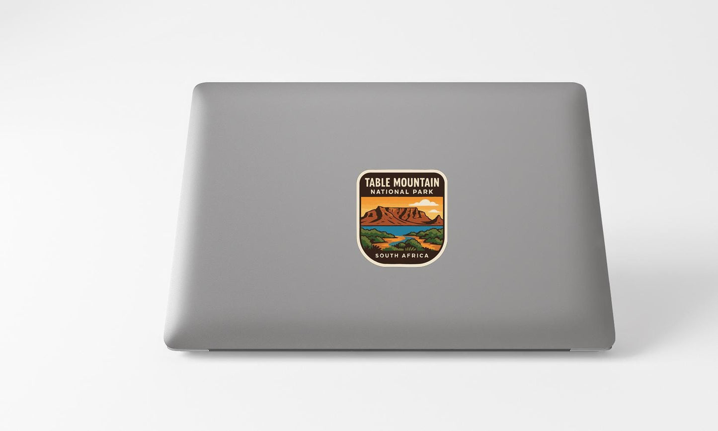 A sticker on the back of a laptop that says "Table Mountain National Park South Africa".