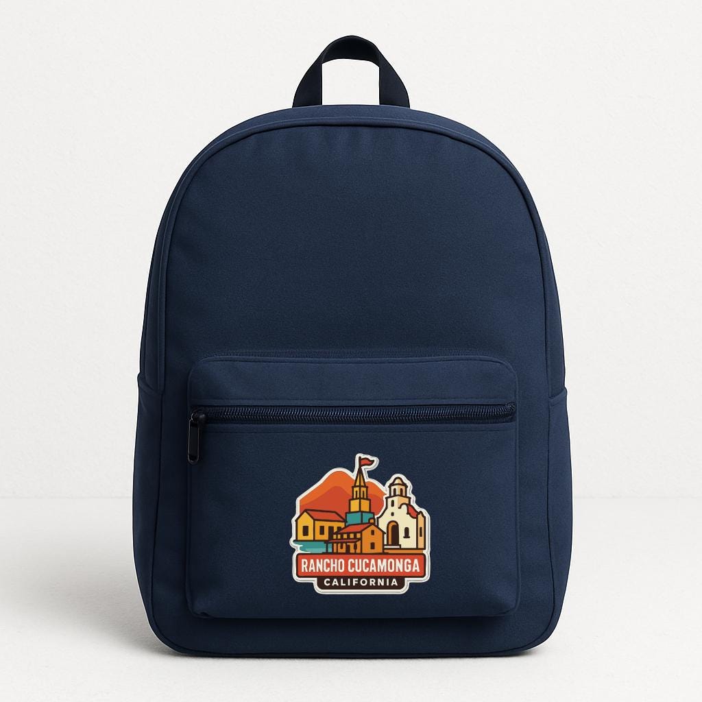 A navy blue backpack with a graphic of a building and the text "RANCHO CUCAMONGA CALIFORNIA" printed on it.