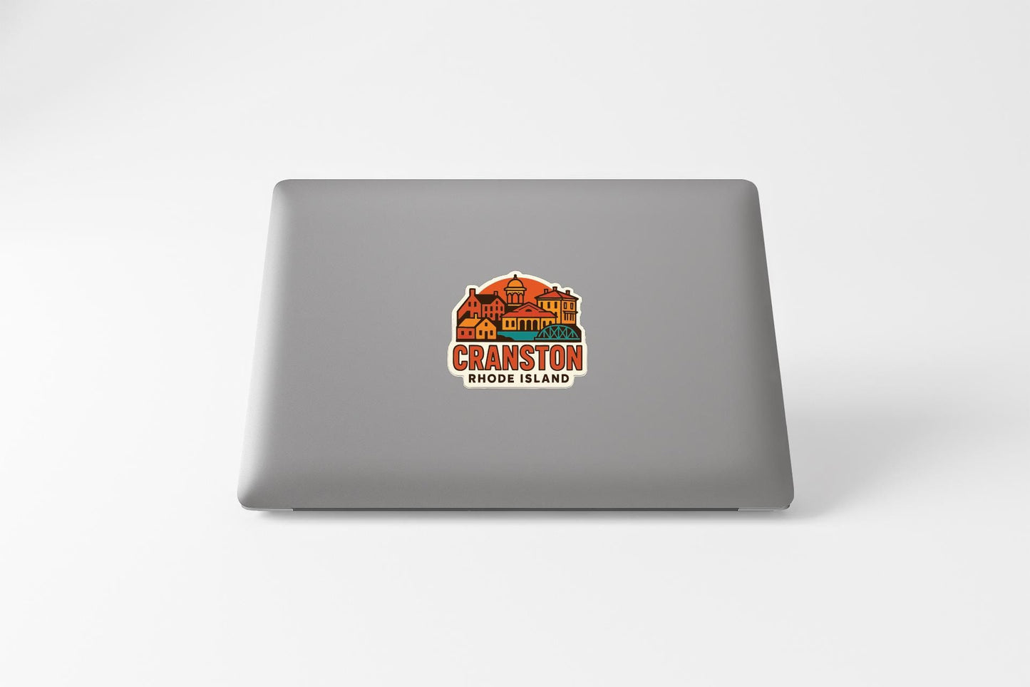 A sticker on the back of a laptop, featuring an illustration of Cranston, Rhode Island.
